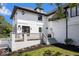 Stunning white home with patio and deck areas. Perfect for entertaining or relaxing at 12208 Island Dr, Indianapolis, IN 46256