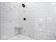 Modern shower with gray and white marble-tiled walls and floors at 12208 Island Dr, Indianapolis, IN 46256