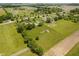 A home and other buildings nestled amongst lawns and farm fields at 12251 E 196Th St, Noblesville, IN 46060