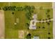 Sprawling property featuring a well-maintained lawn, mature trees, and multiple outbuildings at 12251 E 196Th St, Noblesville, IN 46060