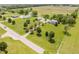 Expansive property featuring a well-maintained lawn, mature trees, and outbuildings at 12251 E 196Th St, Noblesville, IN 46060