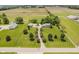 A picturesque aerial view of the property, showcasing the home, surrounding fields, and mature trees at 12251 E 196Th St, Noblesville, IN 46060