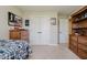 This bedroom features a window, neutral walls, a ceiling fan, and carpeted floors at 12251 E 196Th St, Noblesville, IN 46060