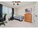 This bedroom features carpeted floors, neutral walls, and a window providing natural light at 12251 E 196Th St, Noblesville, IN 46060