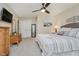 This primary bedroom features a ceiling fan, carpet, and plenty of storage at 12251 E 196Th St, Noblesville, IN 46060