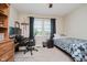 This carpeted bedroom features a window, neutral walls, and a ceiling fan at 12251 E 196Th St, Noblesville, IN 46060