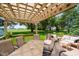 Inviting backyard deck with pergola, complete with comfortable seating and picturesque views at 12251 E 196Th St, Noblesville, IN 46060