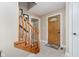 Warm and welcoming foyer featuring tiled floors, wooden front door, and staircase to the next level at 12251 E 196Th St, Noblesville, IN 46060