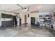This garage features storage cabinets, black appliances, and a sealed concrete floor at 12251 E 196Th St, Noblesville, IN 46060