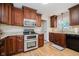 Well-lit kitchen equipped with stainless steel appliances, granite countertops, and wood floors at 12251 E 196Th St, Noblesville, IN 46060