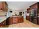 An open kitchen features stainless steel appliances and an island with bar seating at 12251 E 196Th St, Noblesville, IN 46060