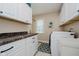 This laundry room features white cabinets and a countertop at 12251 E 196Th St, Noblesville, IN 46060
