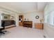 Well-lit living area with plush carpeting, natural wood accents, and an open layout for entertaining at 12251 E 196Th St, Noblesville, IN 46060