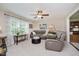 Inviting living room featuring a comfortable leather sofa, ceiling fan, and neutral paint at 12251 E 196Th St, Noblesville, IN 46060