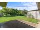 This home features a large backyard space bordered with mature trees and landscaping at 1309 Wyoming Way, Anderson, IN 46013