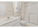 A well-maintained bathroom featuring a shower, white cabinets and commode at 1309 Wyoming Way, Anderson, IN 46013