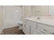 Classic bathroom featuring a tub/shower combination, white cabinets and modern plumbing at 1309 Wyoming Way, Anderson, IN 46013