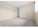 Clean bedroom with neutral carpet and white closet doors at 1309 Wyoming Way, Anderson, IN 46013