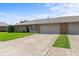 Brick facade with attached garage and well-kept lawn, showcasing a welcoming front exterior at 1309 Wyoming Way, Anderson, IN 46013