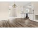Inviting open concept kitchen and dining area featuring wood floors and ample natural light at 1309 Wyoming Way, Anderson, IN 46013