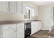 Bright kitchen with white cabinets, modern appliances, and lots of natural light at 1309 Wyoming Way, Anderson, IN 46013