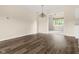 Well-lit living room featuring hardwood floors, an elegant light fixture, and seamless access to other areas at 1309 Wyoming Way, Anderson, IN 46013