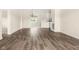 Inviting living room featuring hardwood floors and a seamless transition to the adjacent dining area at 1309 Wyoming Way, Anderson, IN 46013