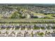 Wide aerial view of the neighborhood showcasing homes and lush green spaces and trees at 14453 Glapthorn Rd, Fishers, IN 46037