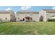 Wide shot of a well-maintained backyard, showcasing the patio area, lush lawn, and privacy at 14453 Glapthorn Rd, Fishers, IN 46037