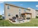 A tidy backyard featuring a patio with dining and lounging areas, complete with landscaping and open sky at 14453 Glapthorn Rd, Fishers, IN 46037
