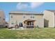 Backyard with patio featuring a pergola, grill, and dining set, perfect for outdoor entertaining and relaxation at 14453 Glapthorn Rd, Fishers, IN 46037