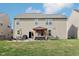 Spacious backyard with a patio area featuring a gazebo, dining furniture, and beautiful landscaping at 14453 Glapthorn Rd, Fishers, IN 46037