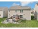 Spacious backyard features stone patio with gazebo and outdoor seating, perfect for entertaining at 14453 Glapthorn Rd, Fishers, IN 46037