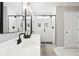 Bright bathroom with modern fixtures, dual sinks, and a walk-in shower at 14453 Glapthorn Rd, Fishers, IN 46037