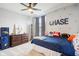 Charming bedroom with hockey-themed decor, including a custom name wall and sporty accents at 14453 Glapthorn Rd, Fishers, IN 46037
