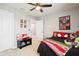 Spacious bedroom featuring superhero themed decor and a ceiling fan at 14453 Glapthorn Rd, Fishers, IN 46037