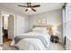 Cozy bedroom featuring a queen bed, accent lighting, neutral decor, and a serene atmosphere at 14453 Glapthorn Rd, Fishers, IN 46037