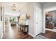 Light filled entryway with hardwood floors and open view into other living spaces at 14453 Glapthorn Rd, Fishers, IN 46037
