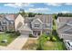 Charming two-story home featuring a two-car garage, landscaped front yard, and inviting front porch at 14453 Glapthorn Rd, Fishers, IN 46037