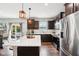 Well-lit kitchen with a view of a patio area through sliding glass doors and stainless steel appliances at 14453 Glapthorn Rd, Fishers, IN 46037