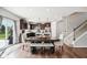 Stylish kitchen with stainless steel appliances, a center island, and a cozy dining area with a bench at 14453 Glapthorn Rd, Fishers, IN 46037