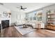 Spacious living room featuring modern decor, fireplace, and large windows at 14453 Glapthorn Rd, Fishers, IN 46037