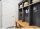 Convenient mudroom with built-in storage lockers, a bench, and ample space for organizing at 14453 Glapthorn Rd, Fishers, IN 46037