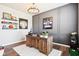 Stylish office space with a large wooden desk, custom wall trim, accent lighting, and sports memorabilia at 14453 Glapthorn Rd, Fishers, IN 46037