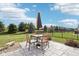 Outdoor patio with table, umbrella, and seating, ideal for enjoying the outdoors with Gathering and friends at 14453 Glapthorn Rd, Fishers, IN 46037