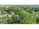 A drone shot of homes surrounded by lush green trees at 1482 Waterford Dr, Zionsville, IN 46077