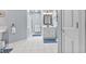 Bright bathroom featuring white cabinets, tile flooring, and a walk-in shower at 1482 Waterford Dr, Zionsville, IN 46077