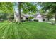 Lovely single-story house with mature trees and inviting walkway at 1482 Waterford Dr, Zionsville, IN 46077