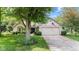 Charming home with a well-manicured lawn, mature trees, and an attached two-car garage at 1482 Waterford Dr, Zionsville, IN 46077