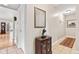 Hallway with neutral walls, tile flooring, and decorative accents at 1482 Waterford Dr, Zionsville, IN 46077